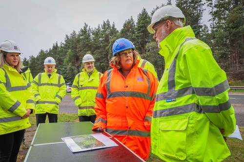 Cabinet Secretary with members of Transport Scotland and Balfour Beatty teams in Tomatin